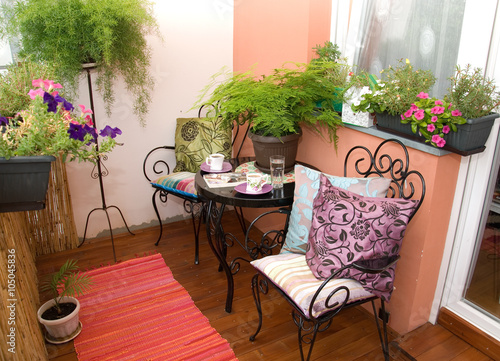 beautiful black furniture on flowery terrace