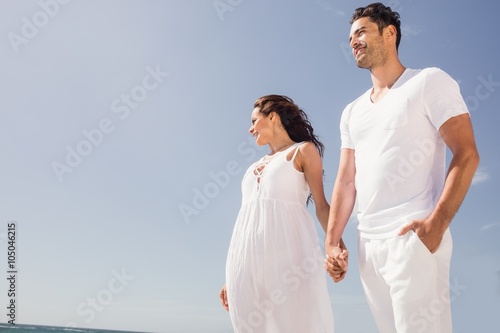 Smiling couple holding hands