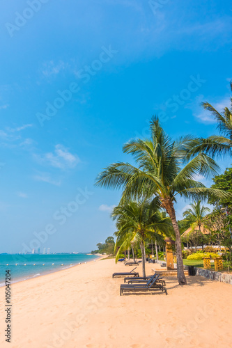 Beautiful beach and sea with palm tree © siraphol