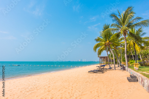 Beautiful beach and sea with palm tree © siraphol