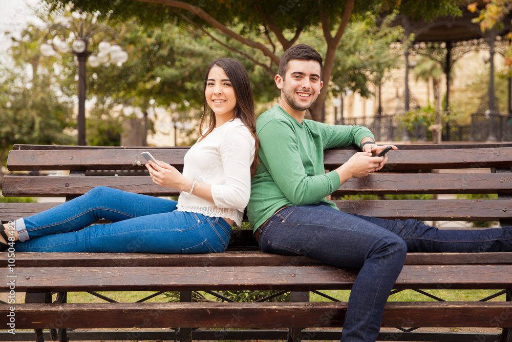 Happy young couple using technology Happy young couple using technology