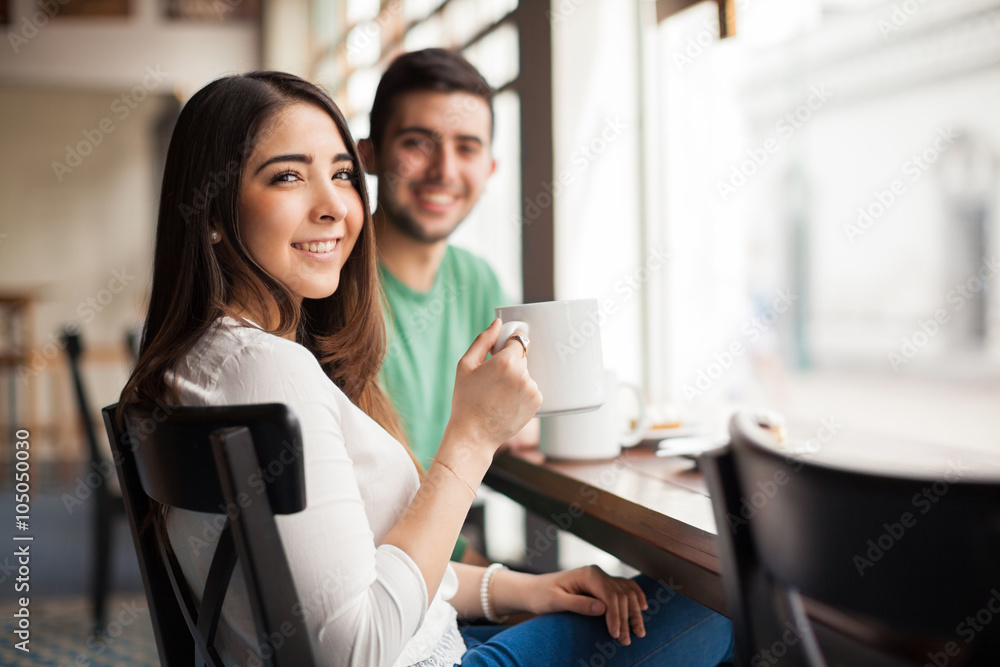 Cute young couple drinking some coffee Cute young couple drinking some coffee