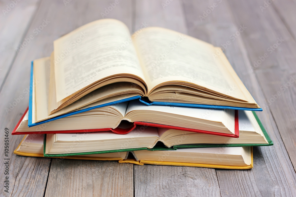 Open books on the table from boards. Open books on the table from boards.