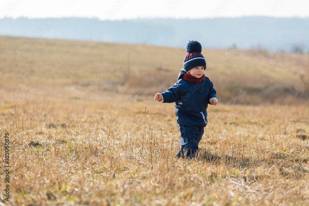 Happy caucasian child playing outdoor Happy caucasian child playing outdoor