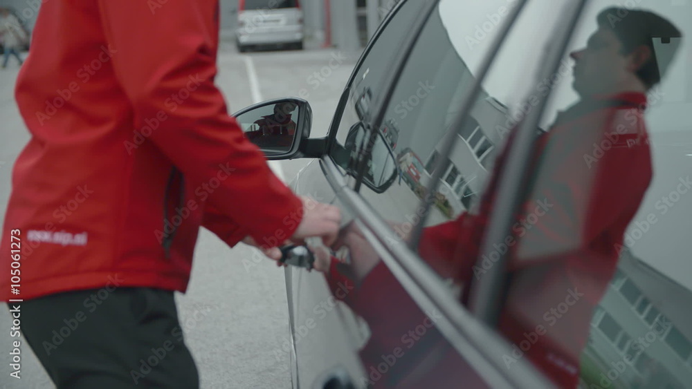 A man is getting in the car A man is getting in the car