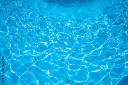 Beautiful water in swimming pool with sun reflection