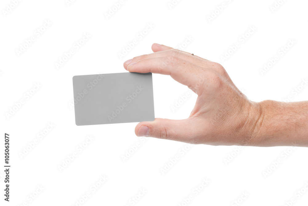 Fototapeta premium gray card in a human hand isolated on white background