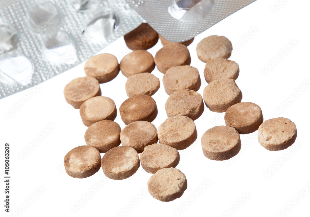 old expired pills and empty packaging on a white background