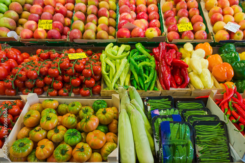 Fruits and vegetables at a farmers market.  Market stall with va