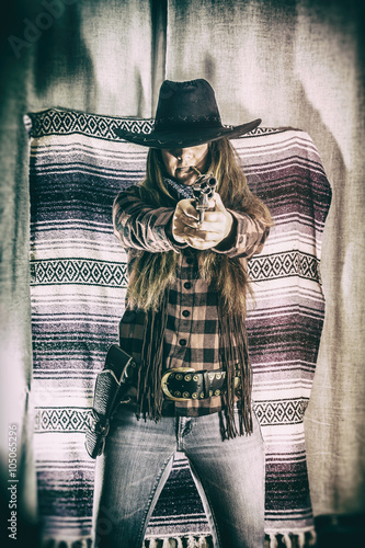 Obraz na plátně Cowgirl Gunslinger Standing and Aiming