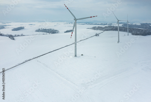 Windmill on the field in winter © Stockr