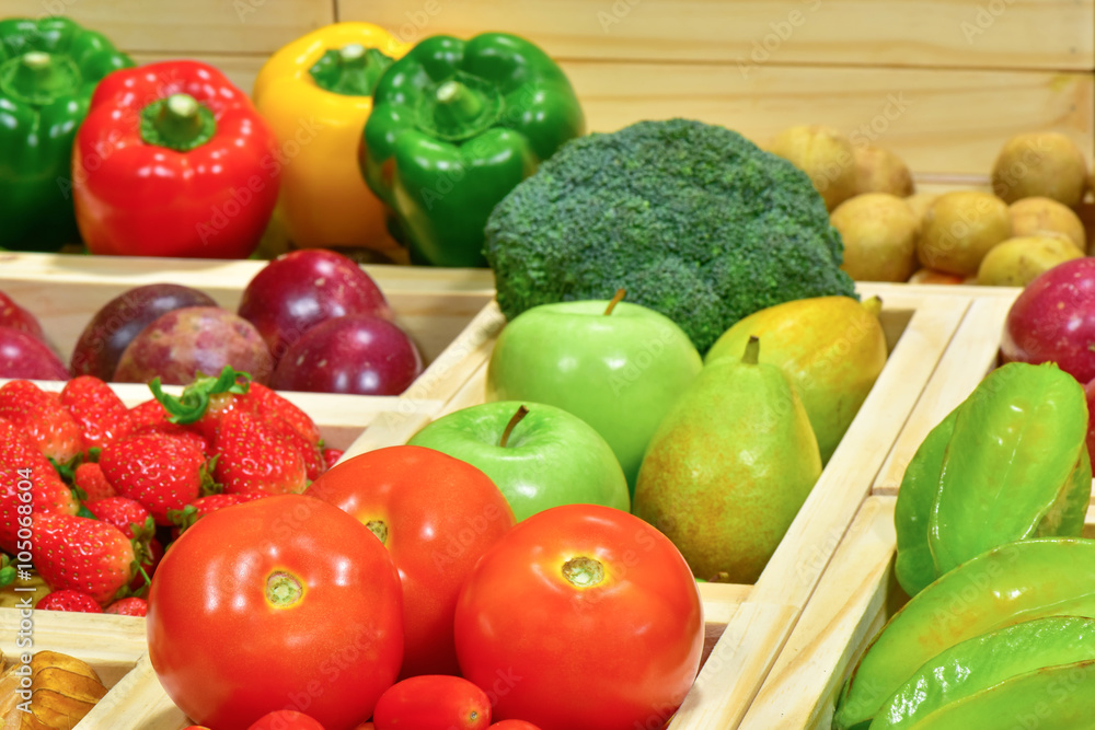 Close-up Tomatoes in wooden box at the supermarket for sale Close-up Tomatoes in wooden box at the supermarket for sale