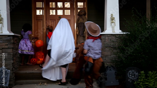 Children in Halloween costumes trick or treating