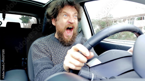 Man screaming scared of getting into accident while driving car slow motion