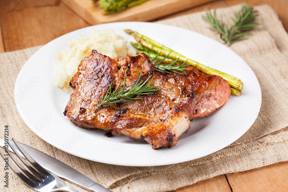 pork chop with mashed potato and asparagus on plate pork chop with mashed potato and asparagus on plate