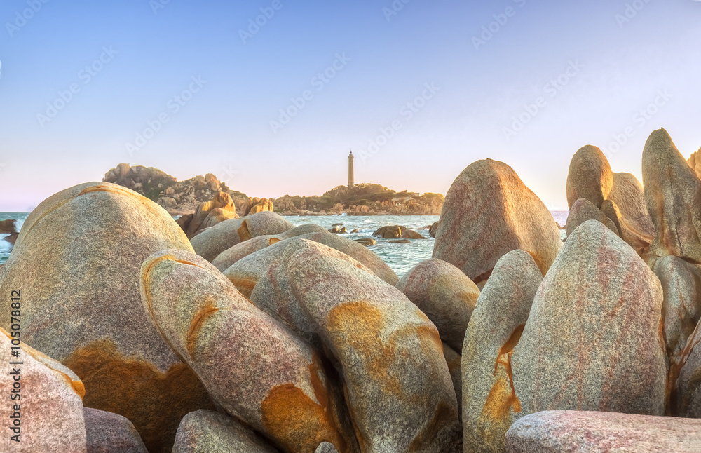 Flower rocky reef on Ke Ga lighthouse jump hundred years old with stones arranged in the shape of the petals in the middle distance is a welcome beacon sunshine beautiful sunset