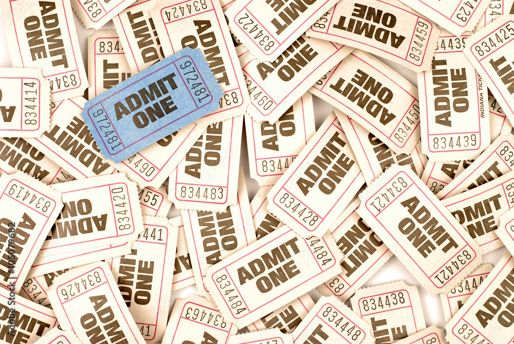 Naklejka premium Admit one white movie cinema ticket lots scattered background with one unique individual blue ticket photo