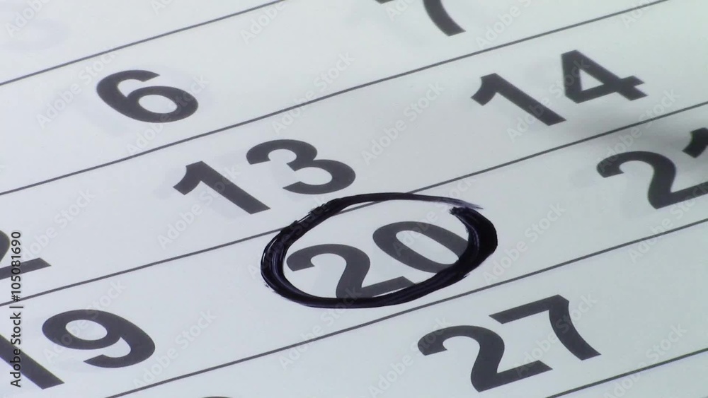 Paper calendar with numbers on columns and rows representing the days of the month, one of them being encircled with a black marker pen Paper calendar with numbers on columns and rows representing the days of the month, one of them being encircled with a black marker pen
