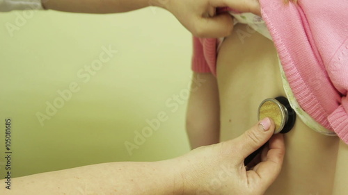 The doctor listens to a child in sight