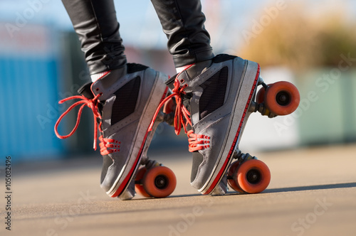 Woman driving with roller skate photo