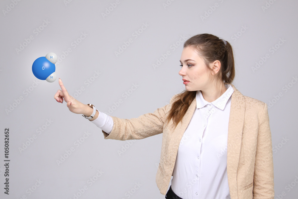 Young woman scientist with model of water molecule. Young woman scientist with model of water molecule.