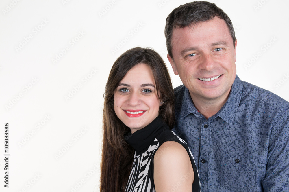 Couple indoors smiling at the camera with copy space Couple indoors smiling at the camera with copy space