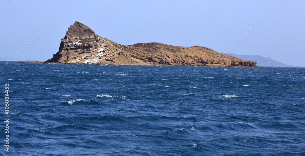 Uninhibited rocky volcanic islet near Hanish island, Yemen
