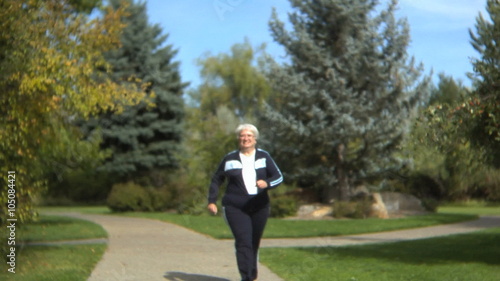 Senior woman walking at a park