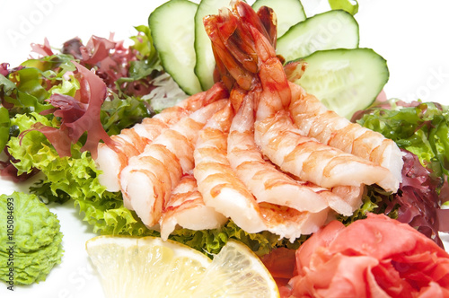 Japanese cuisine sashimi with vegetables and fish in a restaurant