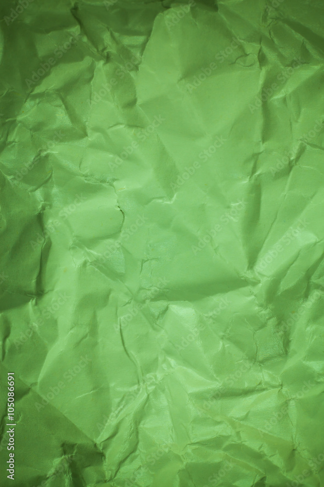 Fototapeta premium Paper background, Crumpled green paper texture.