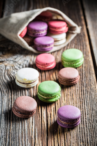 Colorful macaroons on wooden table