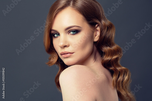 Beauty Woman Portrait. Healthy Long Red Hair and perfect holiday