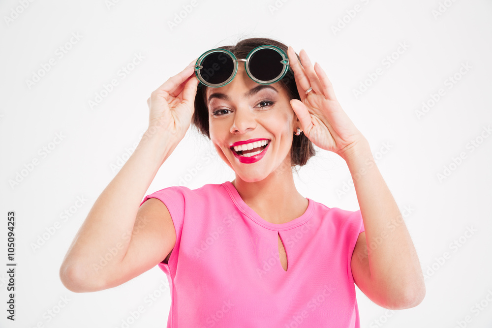 Cheerful charming young woman in sunglasses Cheerful charming young woman in sunglasses