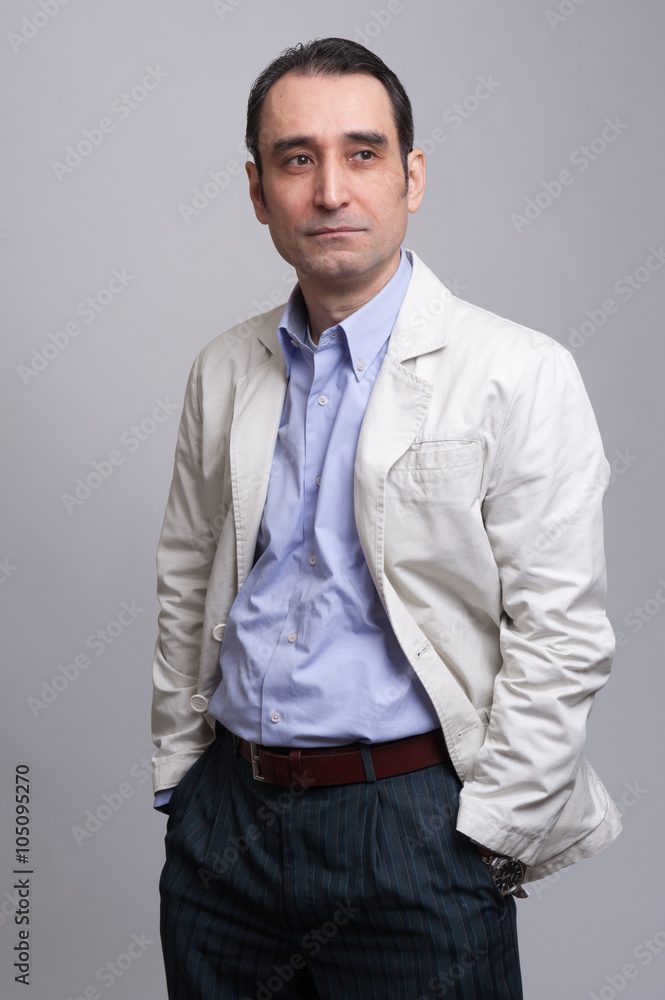 businessman standing on grey background businessman standing on grey background