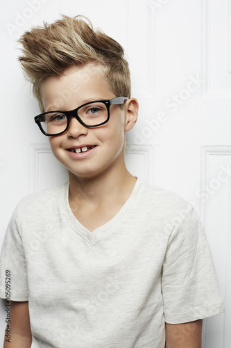 Spiky haired boy in t-shirt, smiling