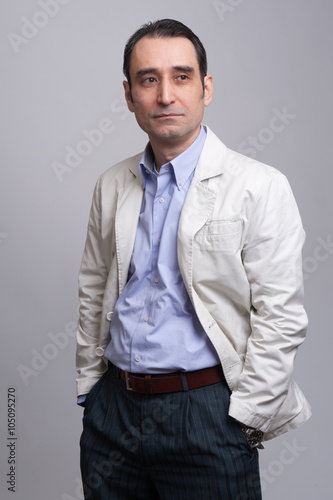  businessman standing on grey background