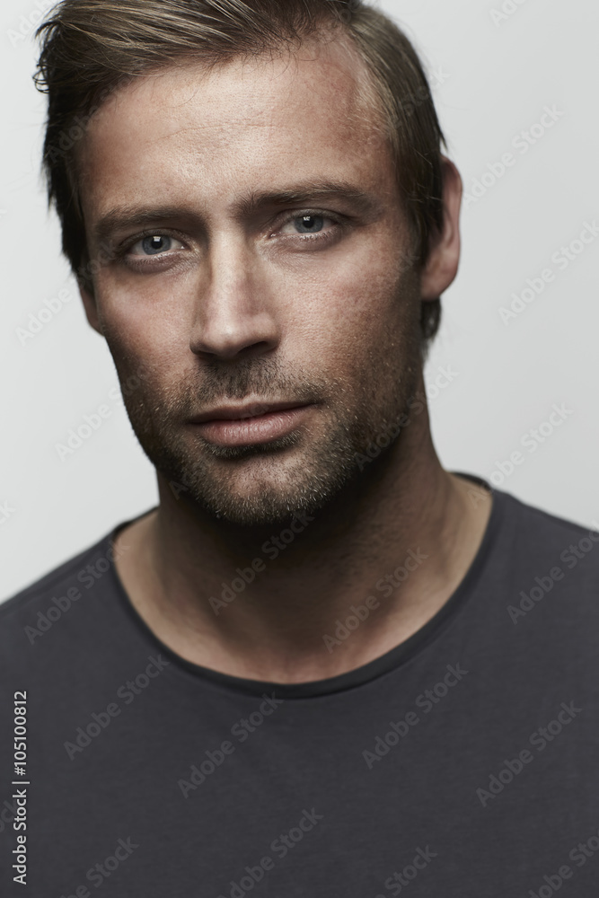 Handsome man with stubble looking at camera Handsome man with stubble looking at camera
