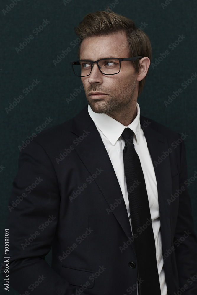 Smart guy in black suit, looking away Smart guy in black suit, looking away