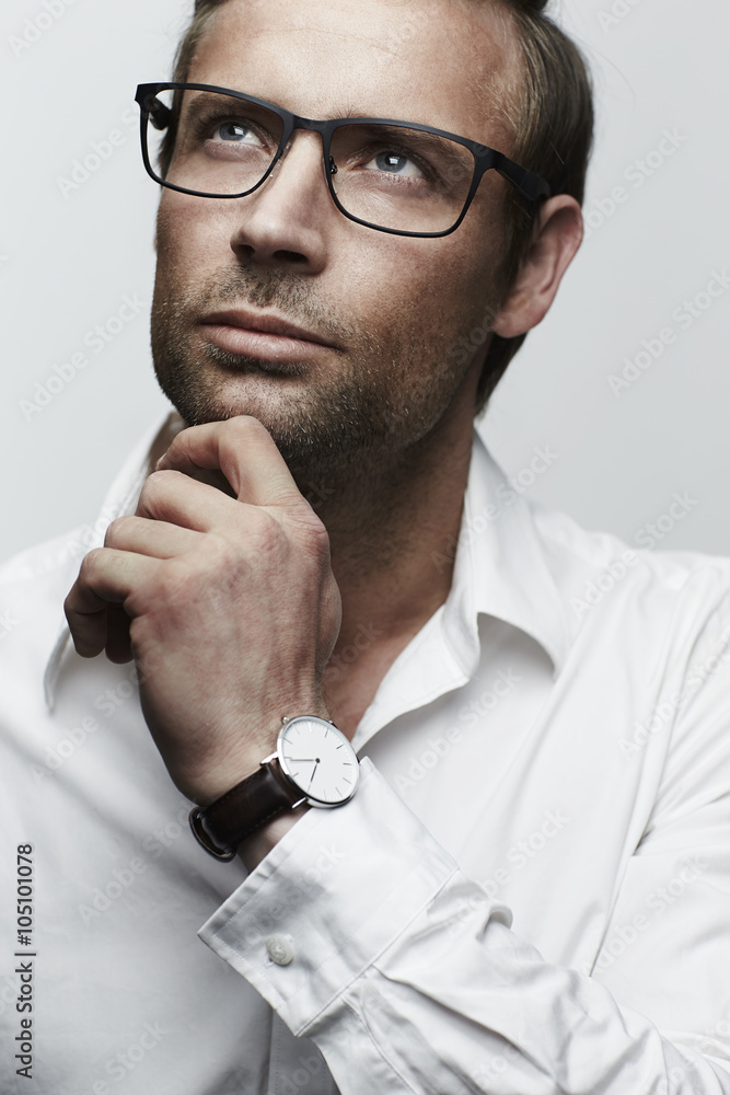 Thoughtful man in spectacles, looking up Thoughtful man in spectacles, looking up