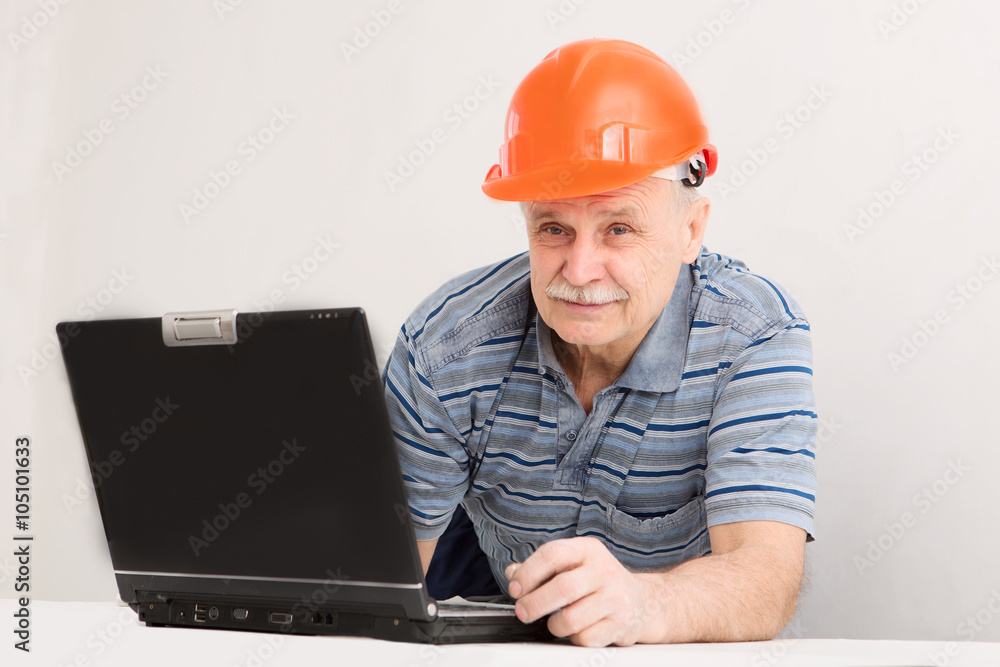 Portrait of construction builder with the laptop Portrait of construction builder with the laptop