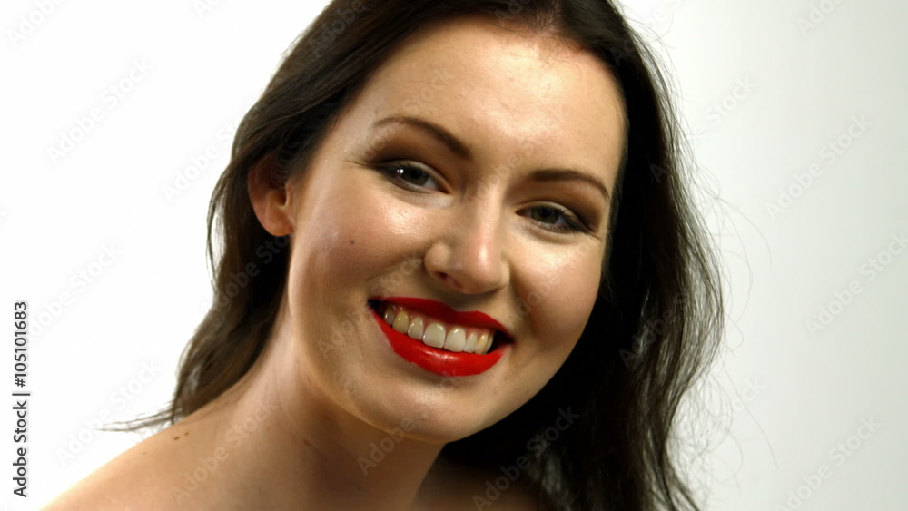 Woman putting red lipstick