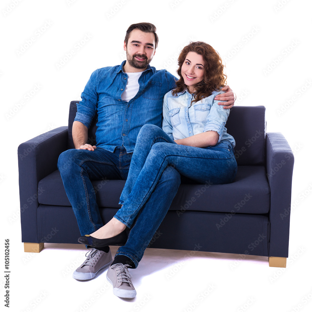 young happy couple sitting on sofa isolated on white Stock Photo | Adobe  Stock