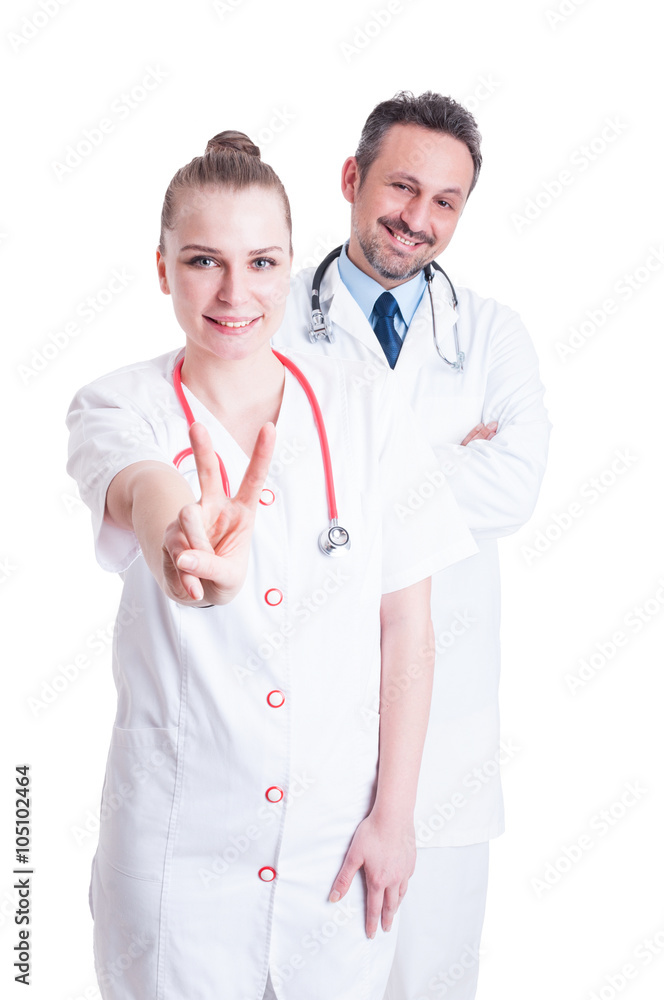 Happy doctors smiling friendly and showing peace or victory gest Happy doctors smiling friendly and showing peace or victory gest