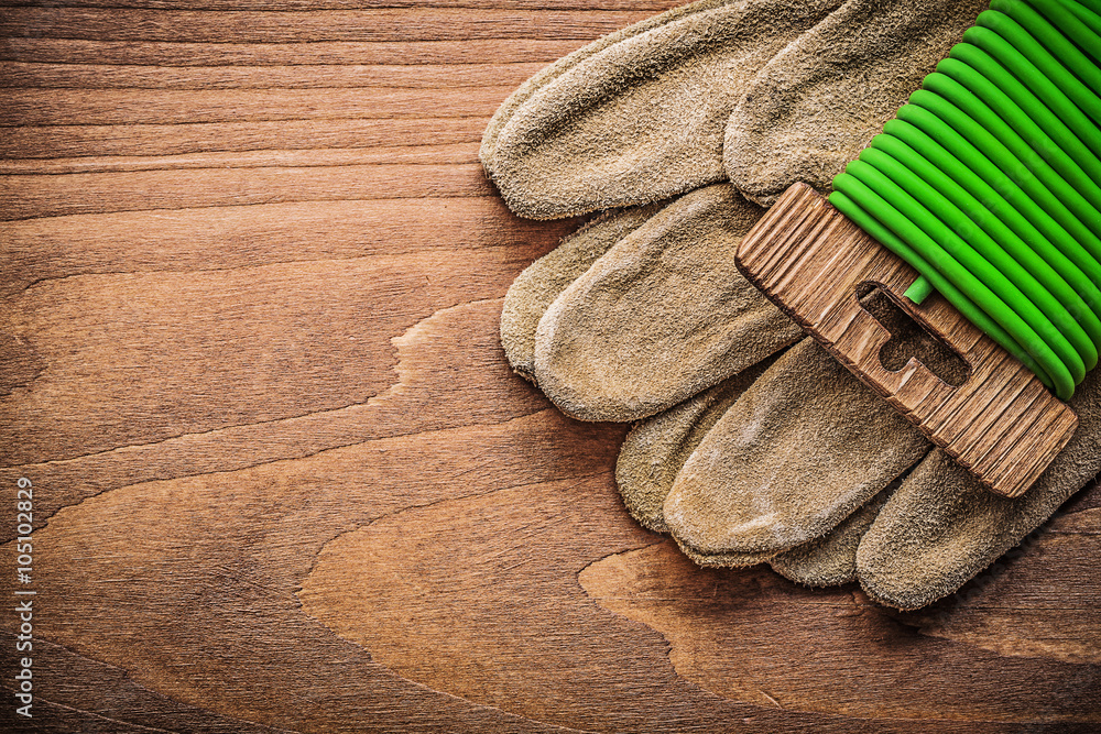 Garden tie wire leather safety gloves on wooden board gardening Garden tie wire leather safety gloves on wooden board gardening