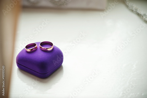 wedding rings and purple ring box