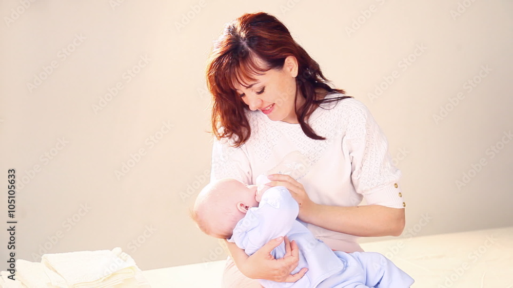 mom feeds the baby bottle mom feeds the baby bottle