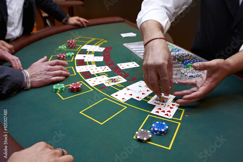 Schilderij op canvas A close up of a blackjack dealer's hands in a casino, very shallow depth of fiel