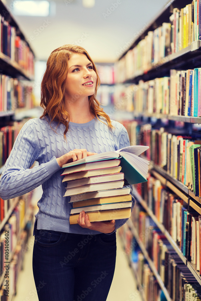 happy student girl or woman with books in library happy student girl or woman with books in library