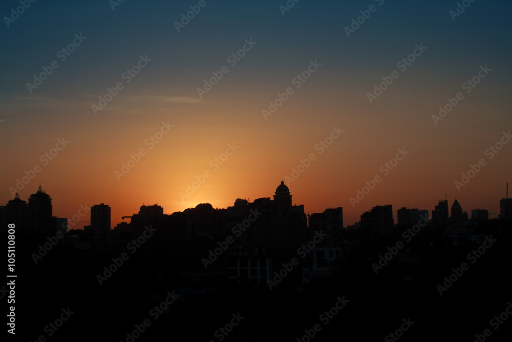 Panoramic silhouette of a big city at sunset. Kiev, Ukraine