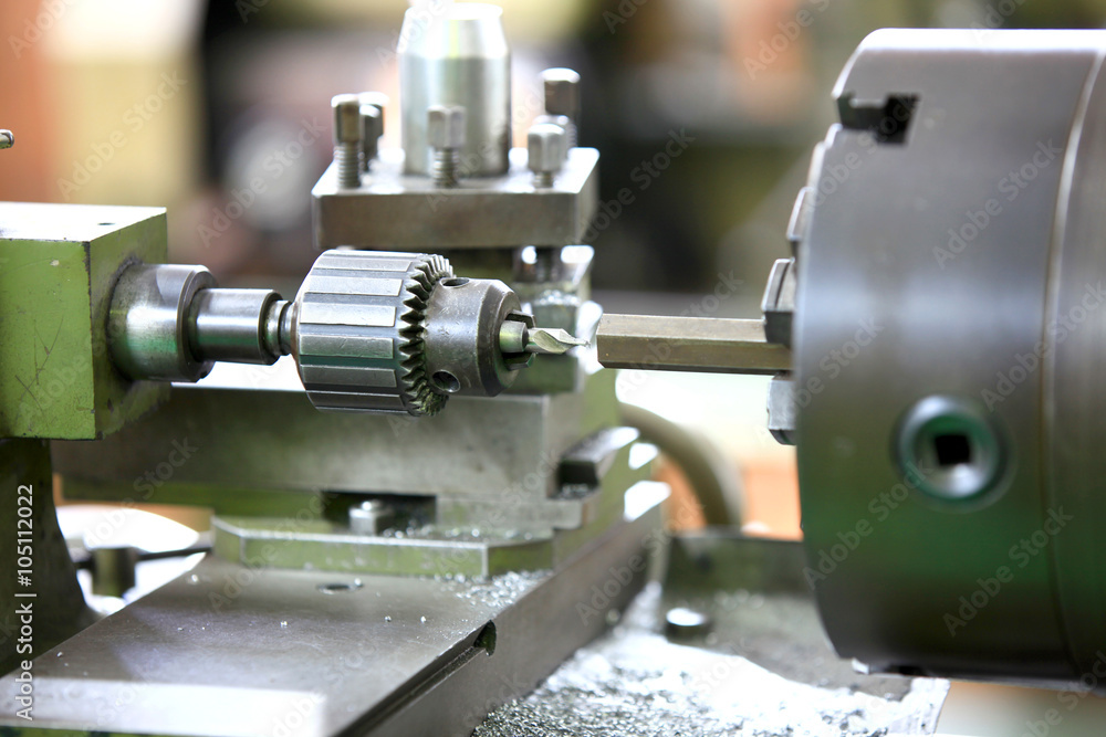 Close up shot of cutting tool on a lathe Close up shot of cutting tool on a lathe